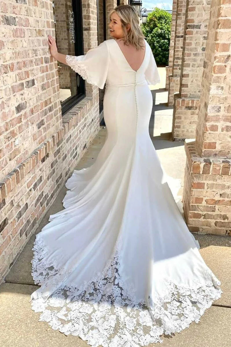 Vestido de novia largo estilo sirena con escote en V y mangas abullonadas y cola larga